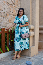 Sky Teal Bold Floral Rayon Foil Maxi Frock – Puff Sleeve Tiered Summer Dress with Adjustable Front Tie & Side Pockets