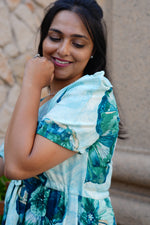 Sky Teal Bold Floral Rayon Foil Maxi Frock – Puff Sleeve Tiered Summer Dress with Adjustable Front Tie & Side Pockets