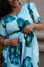 Sky Teal Bold Floral Rayon Foil Maxi Frock – Puff Sleeve Tiered Summer Dress with Adjustable Front Tie & Side Pockets